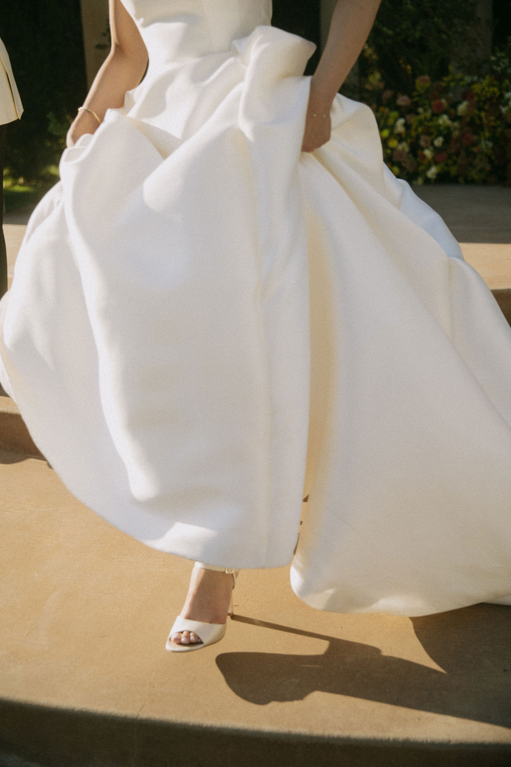 A bride walking in her wedding dress