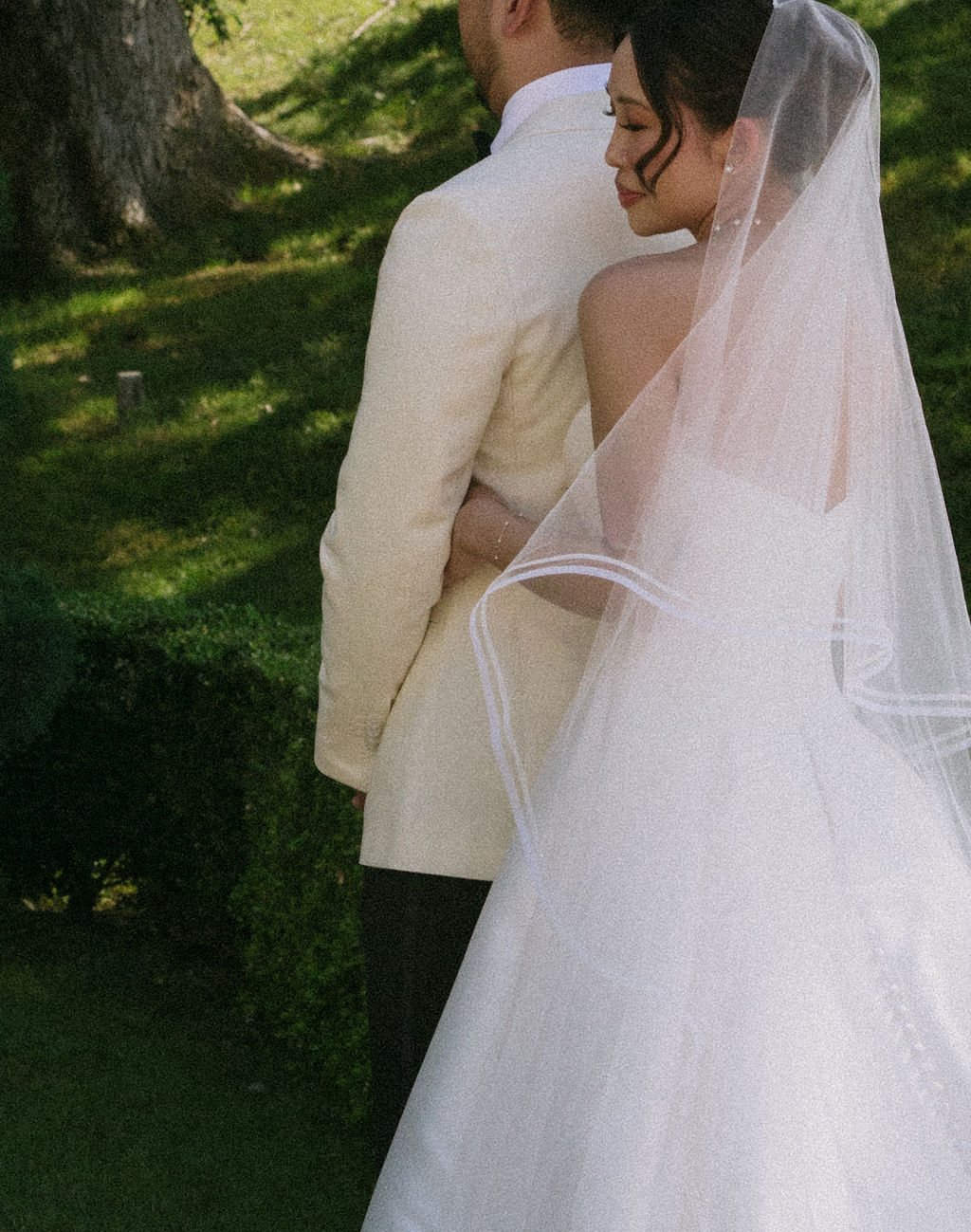A bride and groom posing for wedding photos
