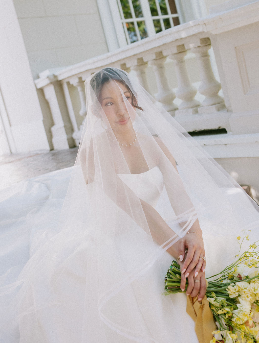 A bride posing for luxury bridal portraits for fall wedding ideas