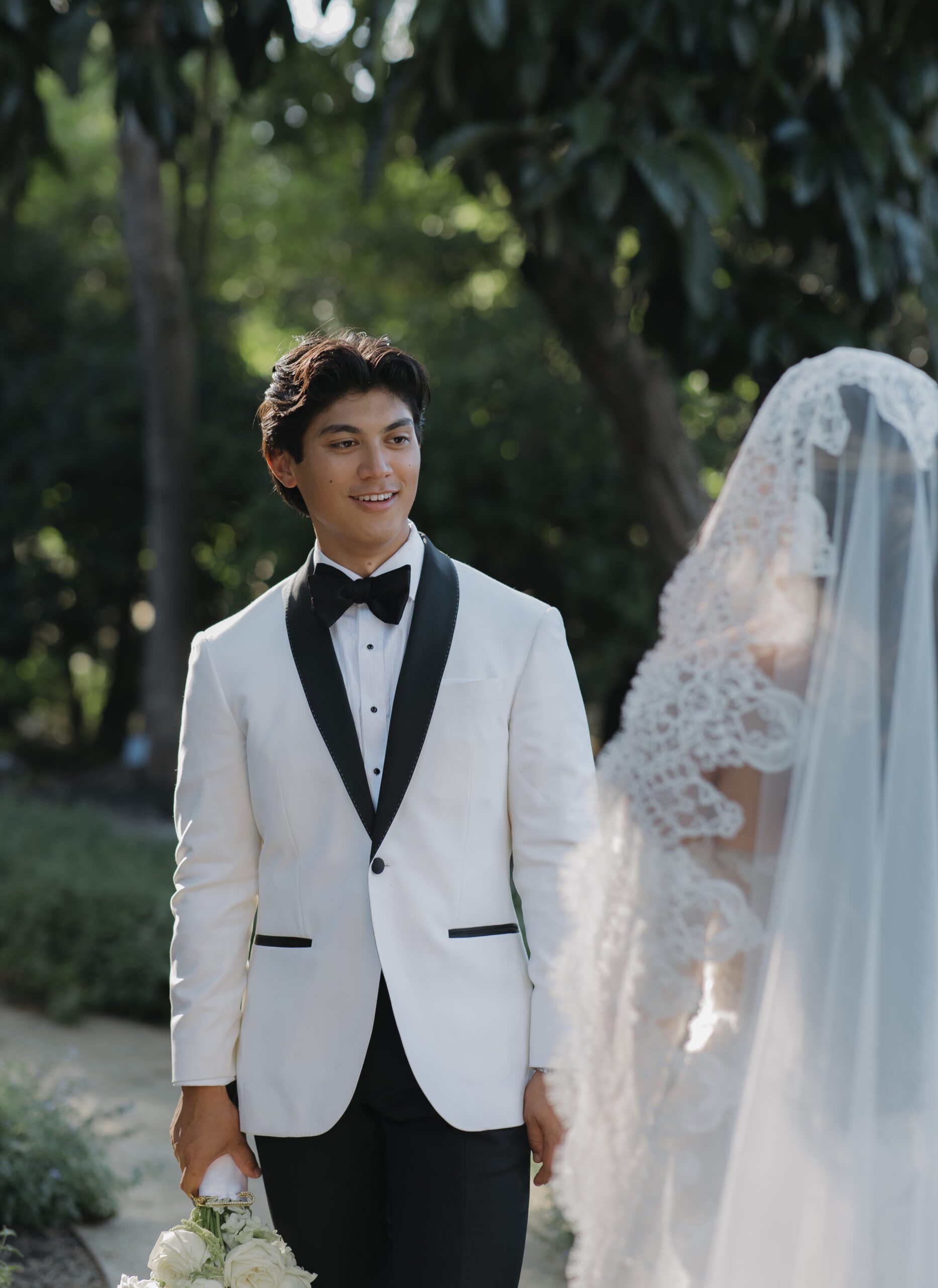 A wedding couple taking photos at their winery wedding venue