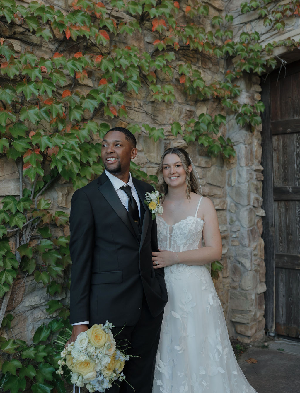 A bride and groom posing for wedding portraits