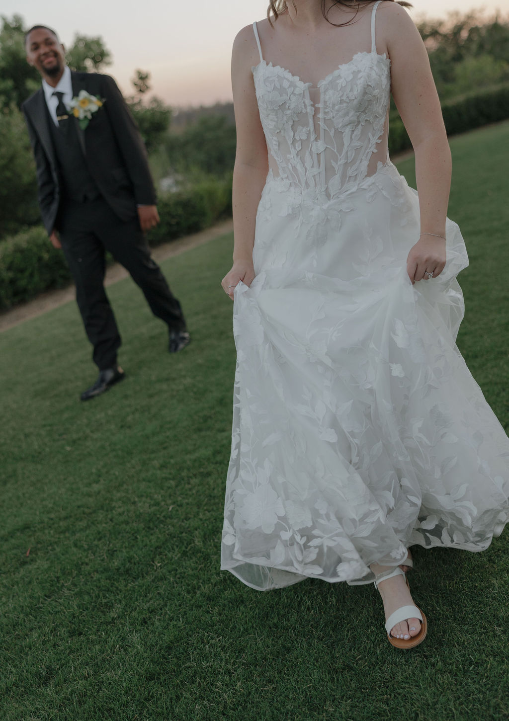 A bride and groom walking