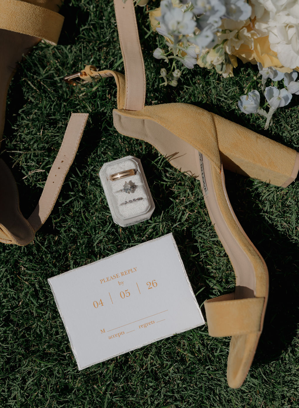 A wedding flat lay with yellow wedding decor