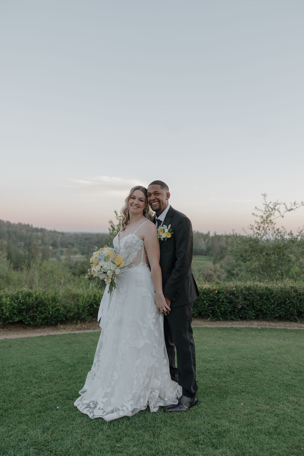 A bride and groom taking wedding photos at Winchester Vista