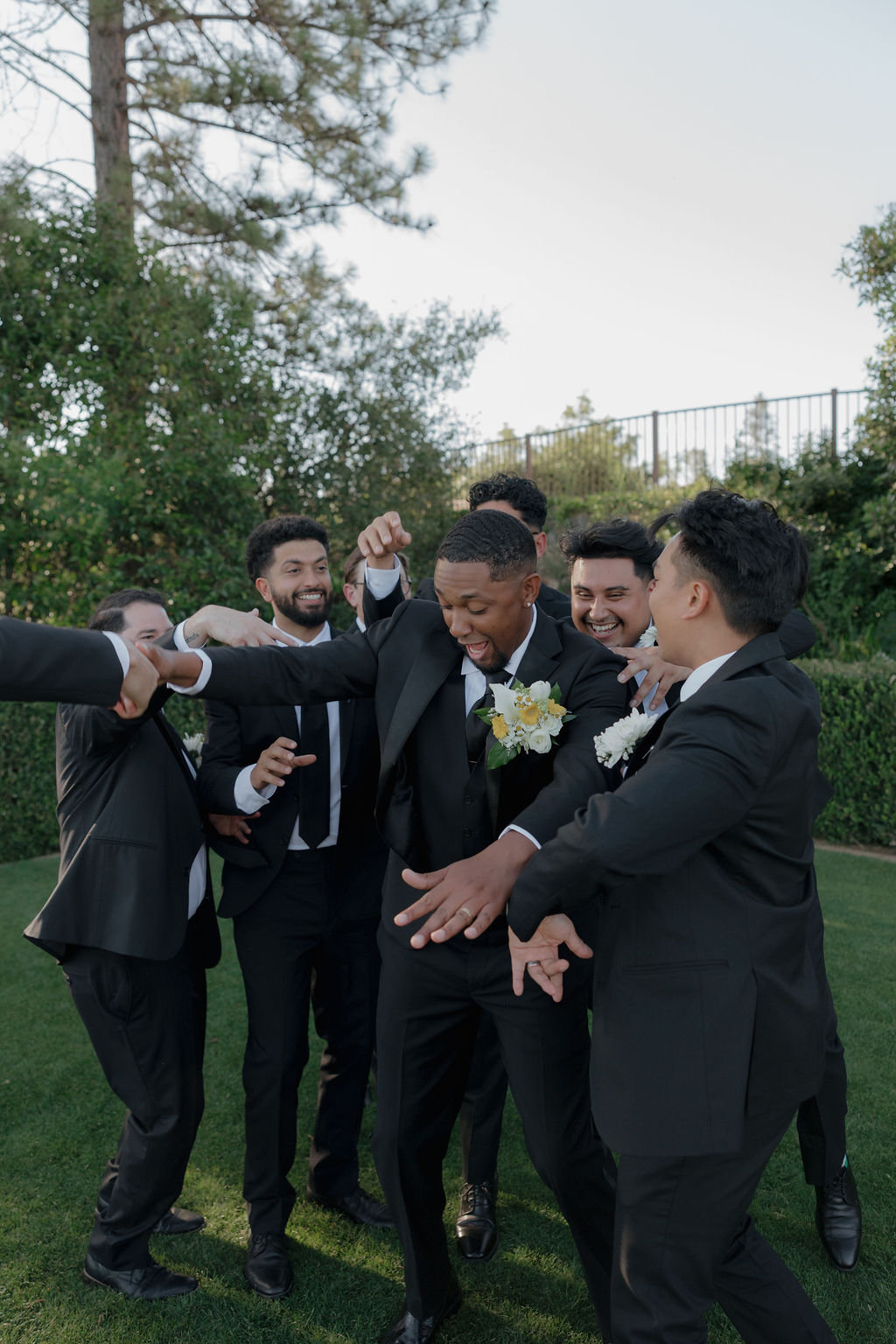 Groom party photos from an outdoor wedding