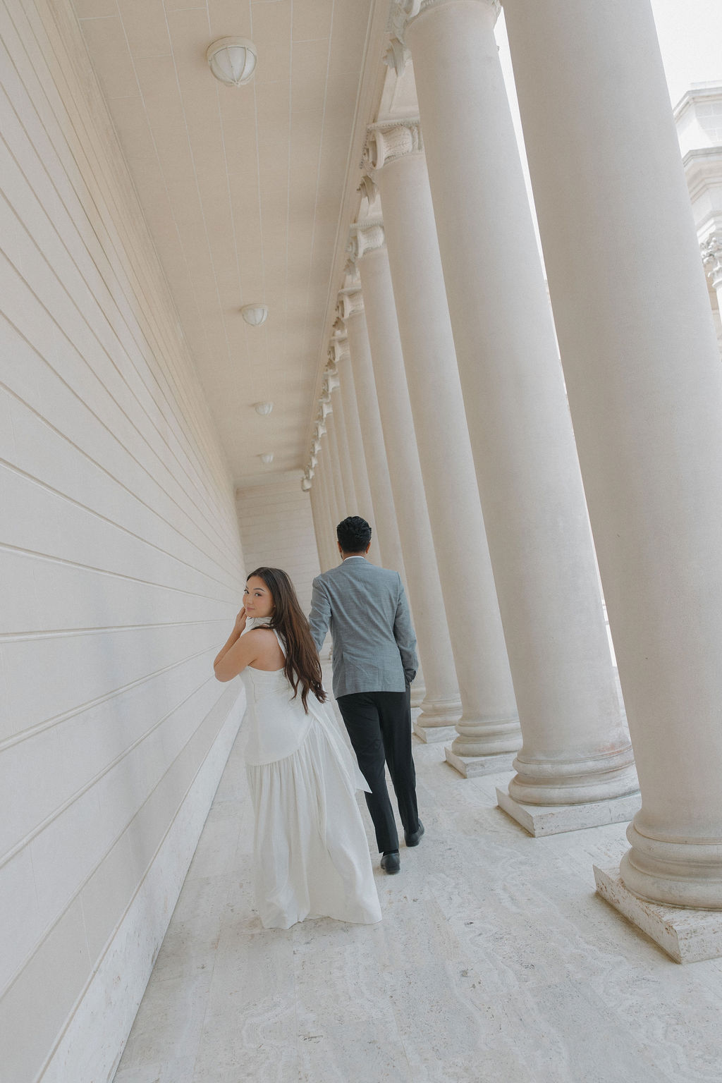 A couple walking through Legion of Honor