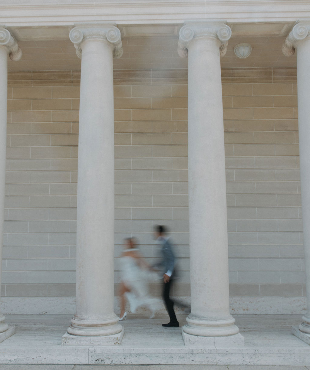 A couple running at Legion of Honor in San Francisco 