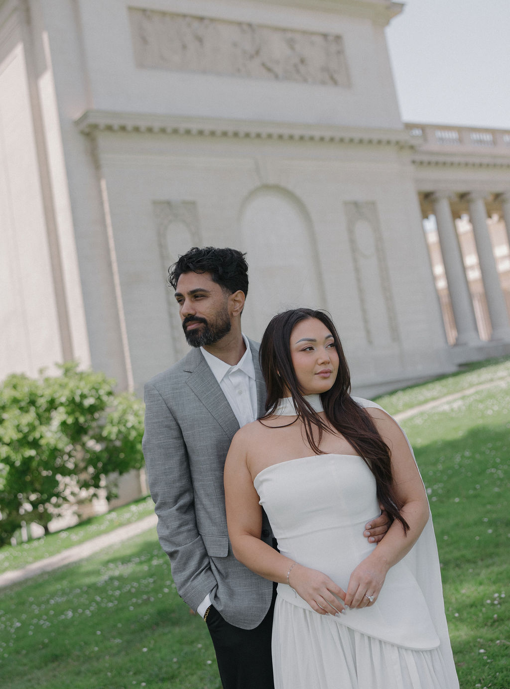 A couple taking engagement photos at Legion of Honor